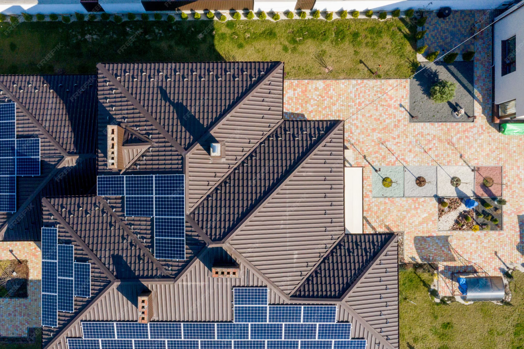Aerial view of a complex pitched tile roof solar installation using SR Solar mounting systems with obstacle-optimized layout