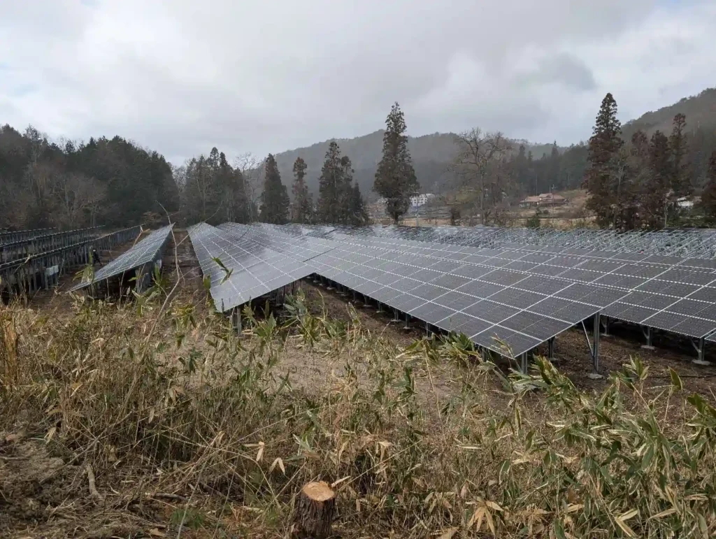 Symmetrical rows of solar panels mounted on SR Solar racking systems in a mountainous region