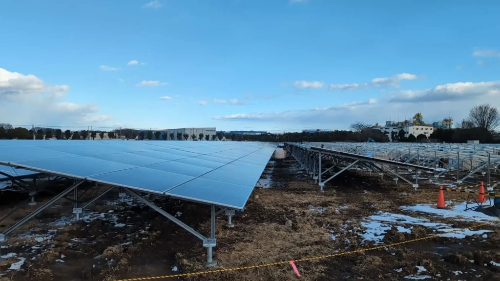 Extensive rows of solar panel arrays and mounting structures at a 3501.76KW commercial solar farm site in Japan.