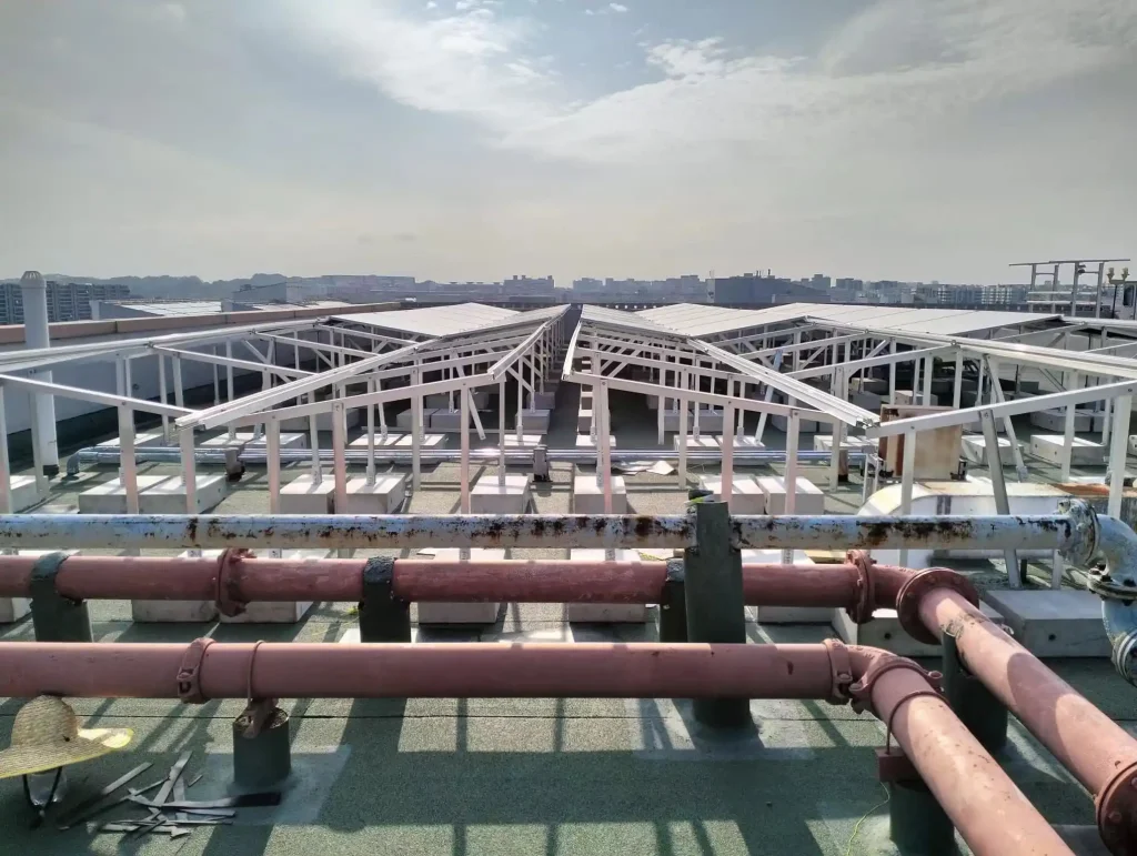 SR Solar ballasted solar mounting system installed on a flat concrete roof for a commercial project in Singapore, manufactured by SR Solar factory