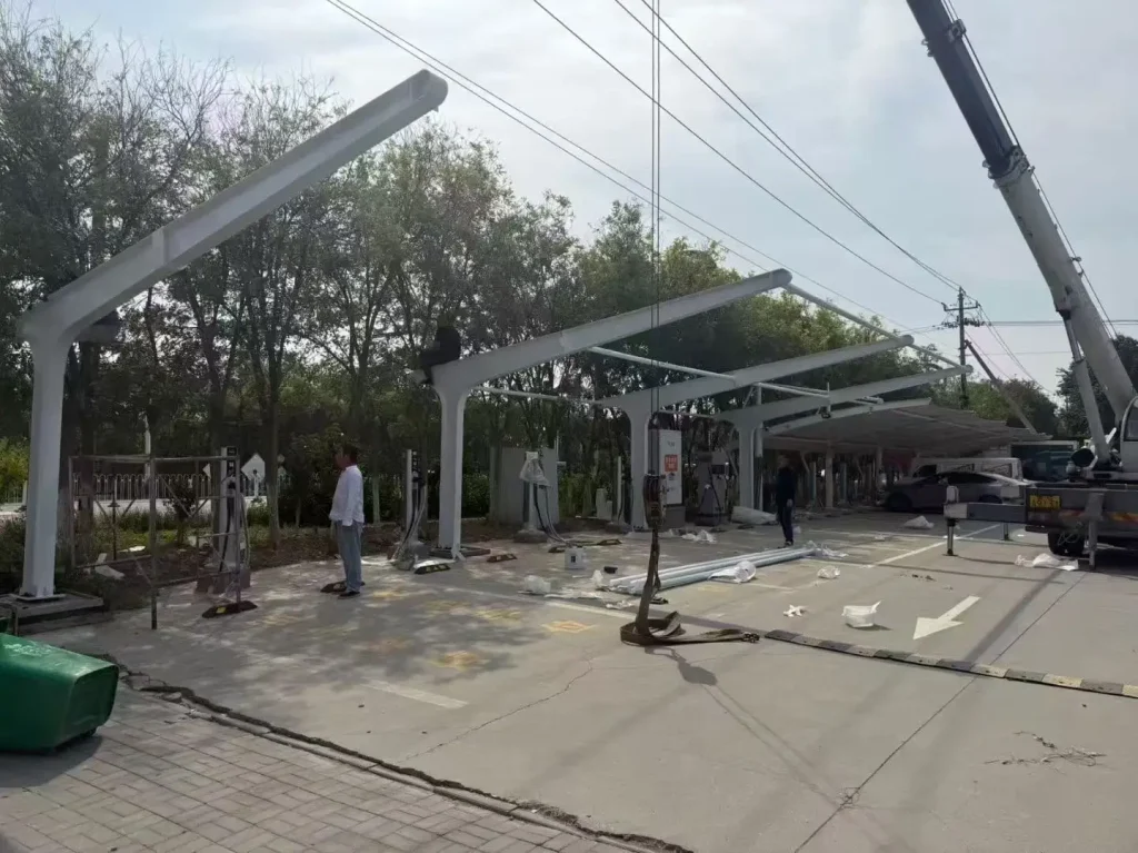 Ongoing construction of an industrial solar carport steel framework from SR Solar manufacturing factory.