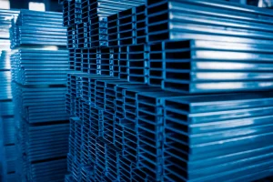 High-quality aluminum and steel profiles stacked in the SR Solar manufacturing factory for solar mounting solutions.