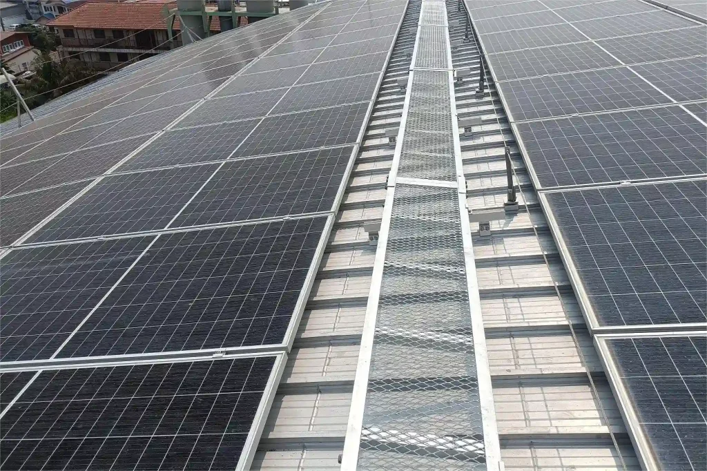 SR Solar industrial metal roof solar mounting structure installed with aluminum rails and walkways.