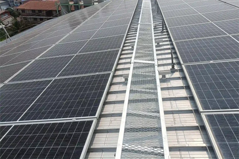 SR Solar industrial metal roof solar mounting structure installed with aluminum rails and walkways.