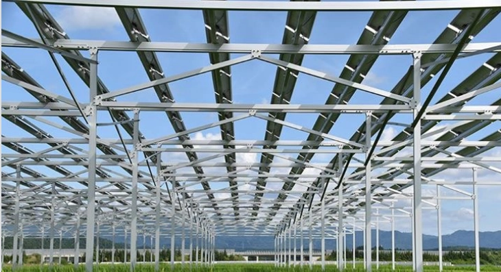 Triangular-design agrivoltaic structure over crop fields manufactured by SR Solar factory.
