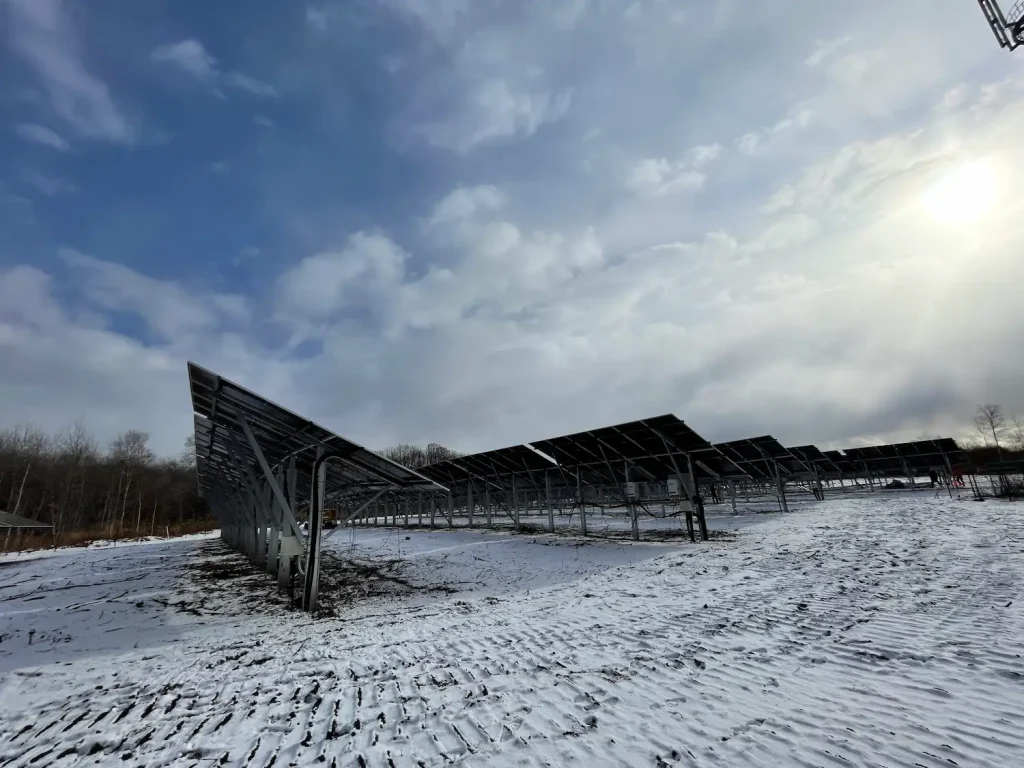 SR Solar 15.6MW utility solar farm mounting racks installed in a snowy winter landscape in Hokkaido.