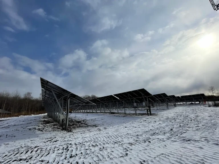 SR Solar 15.6MW utility solar farm mounting racks installed in a snowy winter landscape in Hokkaido.