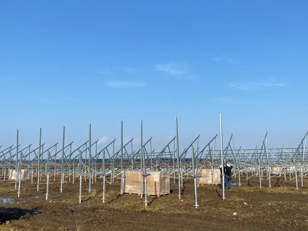 Elevated solar ground mounting solutions designed by SR Solar with ground screw foundations under a clear blue sky in Hokkaido, Japan.