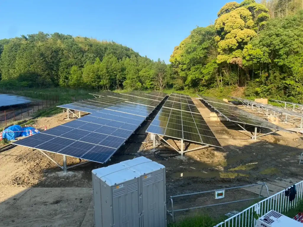 An expansive solar module matrix mounted on SR Solar rigid ground structures across complex terrain.