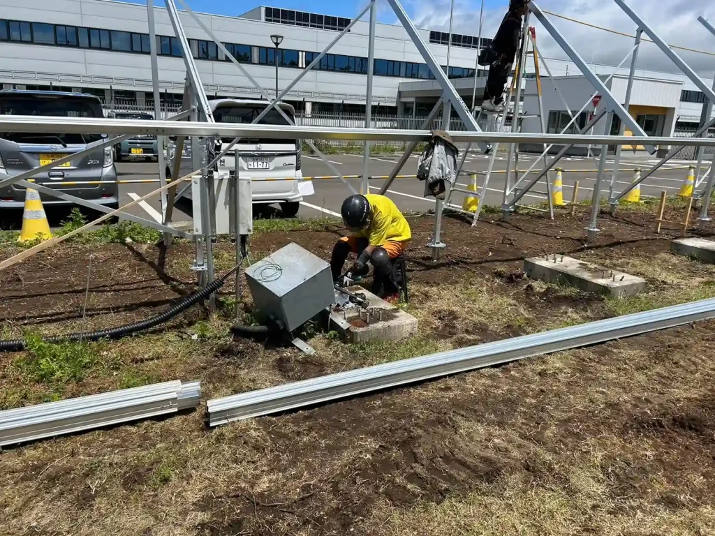 Ground level view of industrial solar mounting systems and structural foundation anchors by SR Solar.