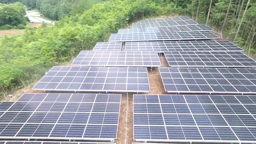 Stepped array layout of industrial solar mounting systems by factory wholesale supplier SR Solar on a cleared hillside.