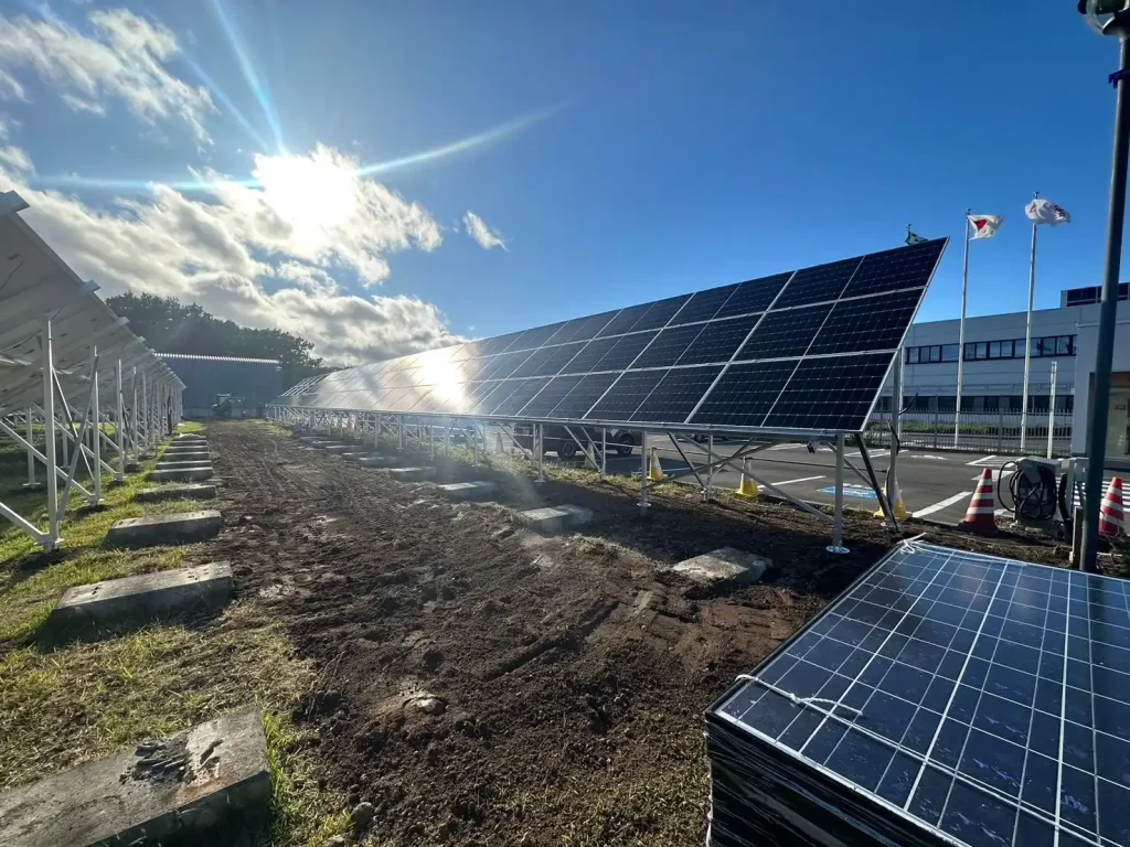 Sunlit commercial PV mounting systems by SR Solar anchored onto concrete block foundations.