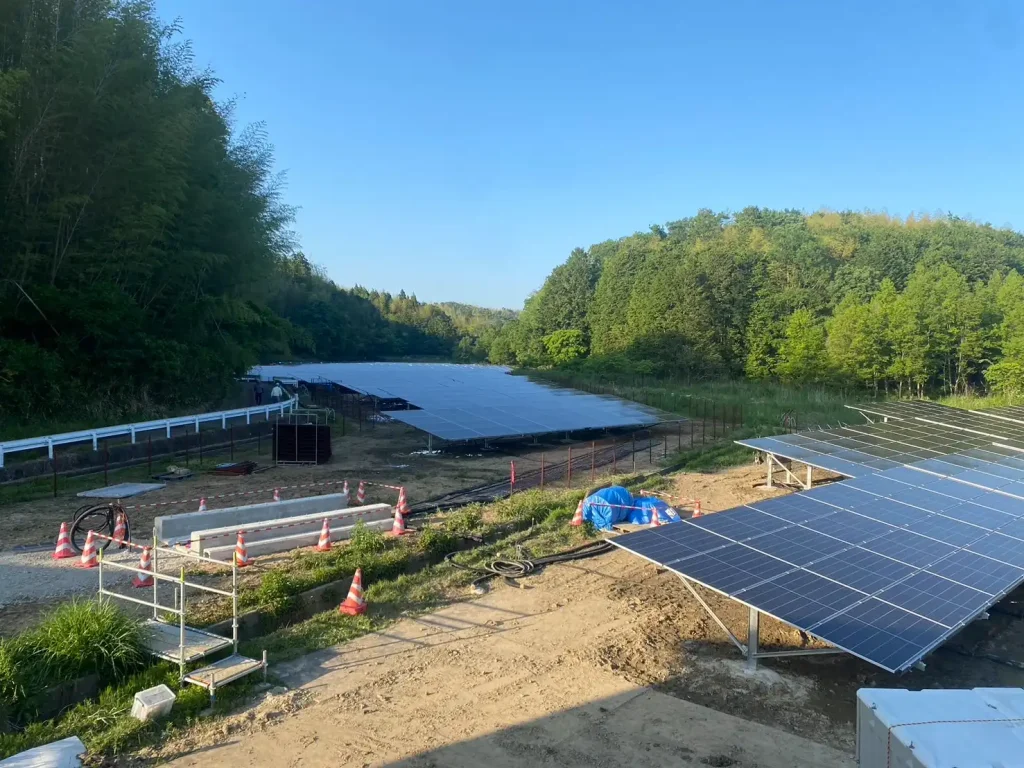 Panoramic view of a large-scale ground solar farm featuring SR Solar mounting structures in Mie Prefecture, Japan.