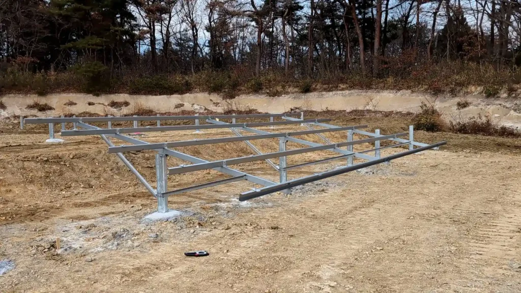 A completed ZAM steel ground mounting structure unit by SR Solar, demonstrating rigid bracing and concrete anchorage.