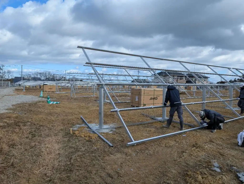 Installers assembling the ZAM steel main frame of SR Solar ground mounting systems for the ACT DREAM project.