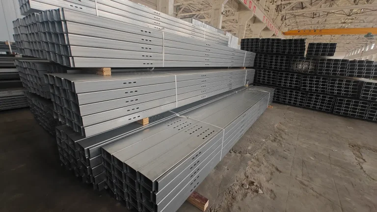 SR Solar pre-punched hot-dip galvanized steel mounting profiles stacked in production workshop