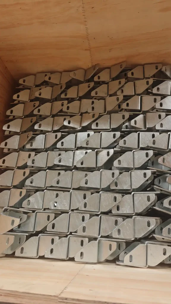 SR Solar custom galvanized steel mounting angle brackets packed in wooden export crate