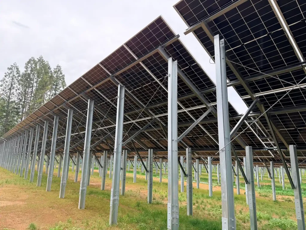 Multi-row ground mount solar panel racking installed in utility-scale solar farm by SR Solar.