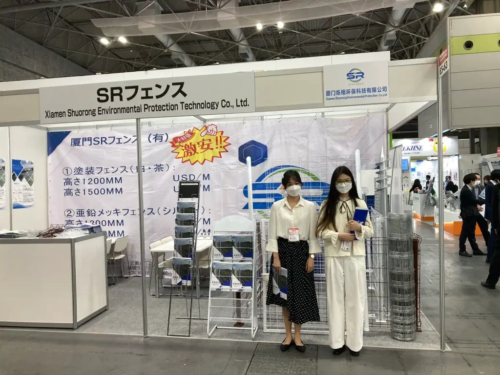 SR Solar booth staff presenting solar mounting and fencing solutions at PV EXPO Osaka 2022.