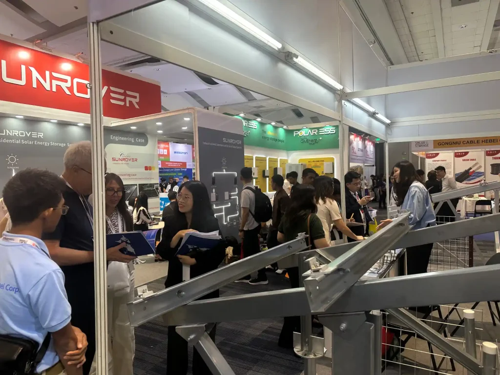 SR Solar specialists conducting B2B consultation for custom solar mounting solutions at booth 2-J10 in Manila.