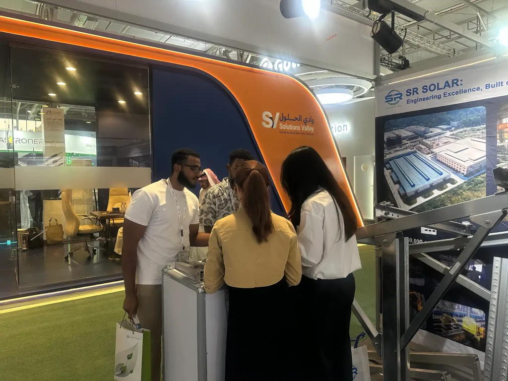 SR Solar representative holding detailed project technical meeting with client at Solar and Storage Live Saudi Arabia booth.
